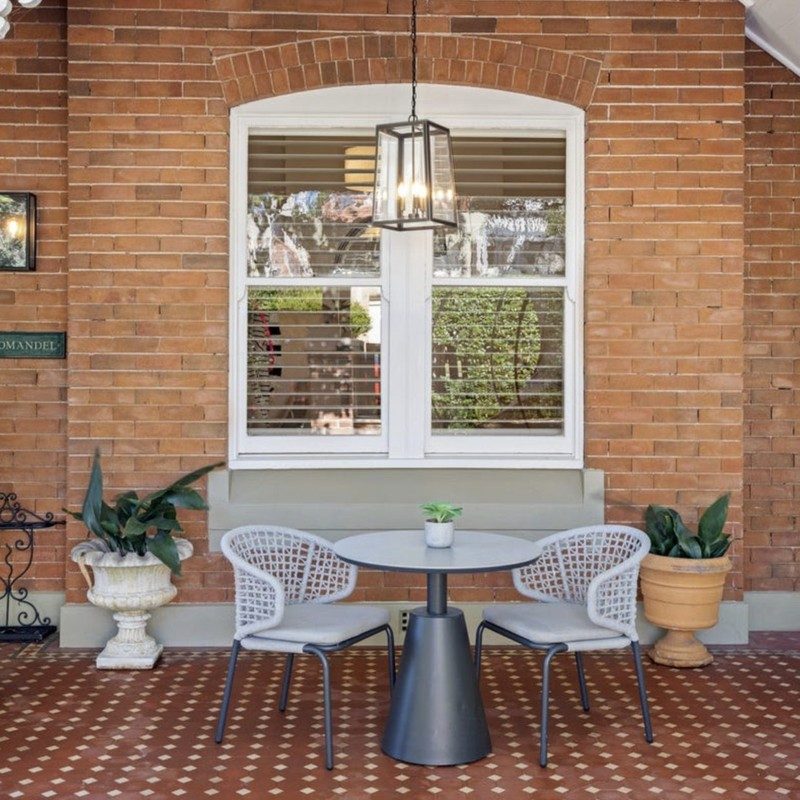 Original verandah with tessellated tiles and an arched brick window on a Federation home, Mosman