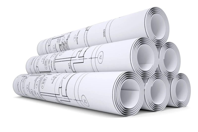 A stack of rolled-up building plans