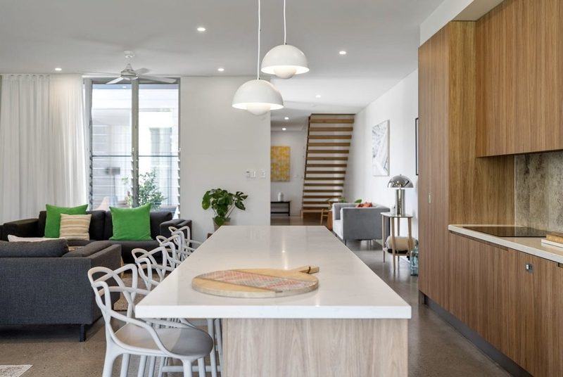 Kitchen is at the centre of the living areas, with clear circulation between zones