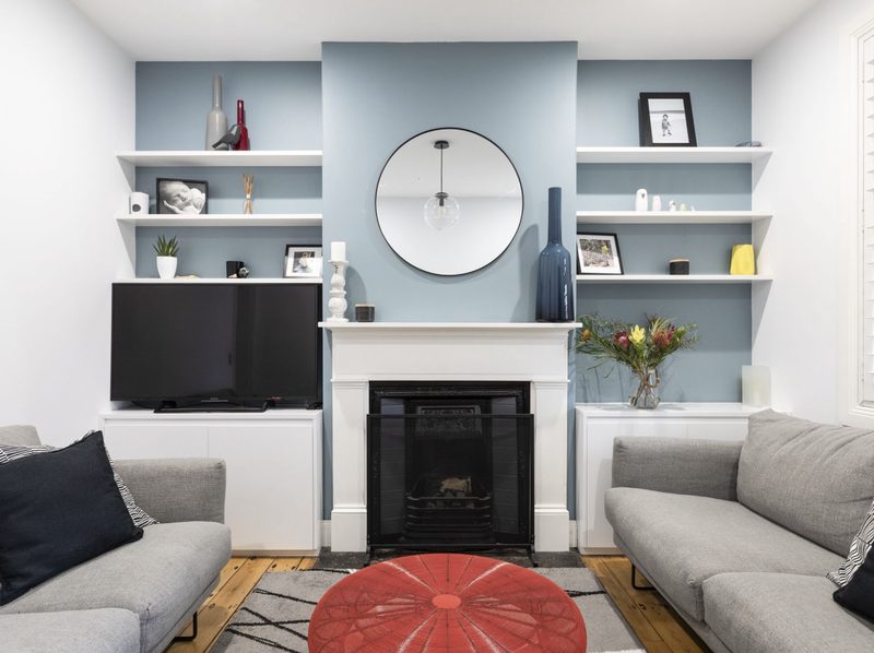 The original cottage is celebrated in the front living room, a quiet contrast to the openness at the back of the house.