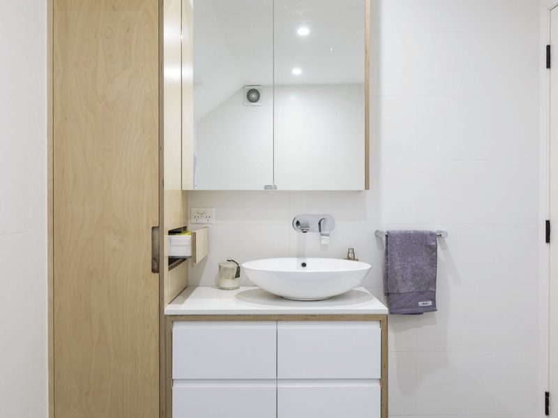 The pared-back palette of materials carries through the whole house, and the joinery ties it together.