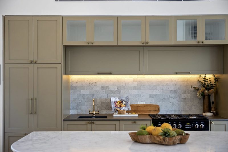 The beautiful kitchen also has a full working kitchen behind when more prep space is needed for entertaining
