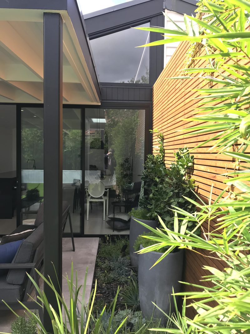 A garden against the side fence brings life to the house and outside living spaces